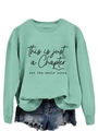Detail of mint green sweatshirt featuring black printed slogan this is just a chapter - S / Black Font / Light Green