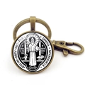 Macro detail of vintage bronze Saint Benedict Medal keychain with glass cabochon insert - St. Benedict Vintage Medal Style 8 (JY008670-Copper 8)