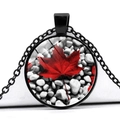 Macro shot of circular Canada maple leaf glass pendant necklace with black metal chain - Pebble Texture Style (JY008658-9)