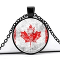 Macro shot of circular glass pendant necklace with vintage Canadian maple leaf flag design - Retro Scratched Style (JY008658-8)