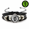 Detail view of woven leather St. Benedict medal bracelet with luminous effect features - Transparent Glass Cover Medal Style (JY008668-5)