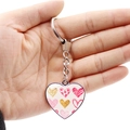 Romantic heart keychain with pink patterns and silver ring held against white background - Romantic Pink Heart Combination (JY008683-8)