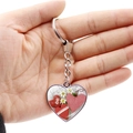 Double-sided heart keychain with red plaid and floral patterns held in hand - Floral Plaid Polka Dot Composite (JY008371-7)