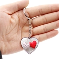 Macro view of double-sided heart pendant keychain with red and white polka dot patterns - Red White Polka Dot Wood Heart (JY008683-3)