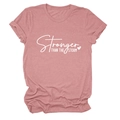 Detail of Stronger Than The Storm slogan print and rolled sleeves on cotton t-shirt - Rose Gold (White Font)