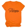 Close-up of Stronger Than The Storm slogan and heart print on orange cotton T-shirt - Orange (Black Font)