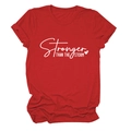 Close-up of Stronger Than The Storm lettering on a red crewneck cotton T-shirt - Red (White Font)