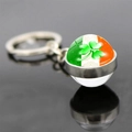 Macro view of Ireland flag glass dome keychain with green clover on reflective surface - Fine Craft Ireland Theme Style 12 (JY008582-12)