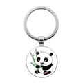 Macro view of a round metal keychain with a cute panda eating green bamboo design - Glossy Panda Chewing Bamboo Style (JY008709-9)