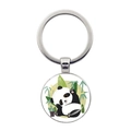 Detail of silver metal keychain featuring a cute panda illustration with bamboo leaves - Side-sitting Panda with Yellow Flowers Style (JY008709-8)