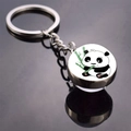 Detailed view of a round glass keychain pendant featuring a cute panda eating bamboo - Q-Style Panda Holding Bamboo (JY008711-9)
