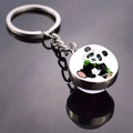 Detail of cute panda keychain with double-sided glass pendant on metallic ring - Panda Sitting and Holding Bamboo (JY008711-6)