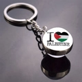 Double-sided glass ball Palestine flag keychain with I Love Palestine design on grey surface - I Love Palestine Heart Style (JY008766-12)