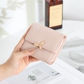 Minimalist short PU leather wallet for women with golden leaf clasp and embroidery - Pink