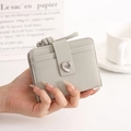Detail of grey PU leather card holder with heart buckle and multiple card slots - Green