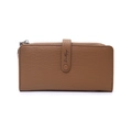 Detailed close-up of camel brown pebble leather texture and metal buckle on long wallet - Yellow Brown