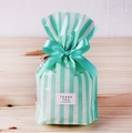 Detail of light green striped gift bag with satin bow and Thank You label decoration - Striped / 50 Pieces / Green