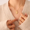 Retro 18K gold plated oval portrait pendant necklace with beaded chain on model - Gold Necklace