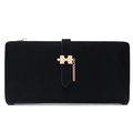 Detail of black suede texture long wallet featuring gold puzzle-shaped metal buckle clasp - Black