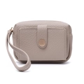 Detail showing taupe lychee pattern leather wallet with snap closure and wrist strap - Apricot