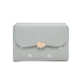 Detail of floral print on light blue wallet with golden flower metal clasps and stitching - Blue