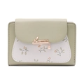 Close-up of sage green PU leather wallet featuring white floral pattern and leaf pendant - Green