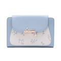 Detail of light blue faux leather wallet featuring floral prints and gold leaf clasp - Sky Blue