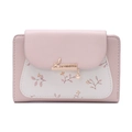 Detail of light pink floral wallet featuring gold metal leaf clasp and bead charm - Pink