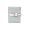 Detail of mint green textured faux leather wallet featuring a gold bow buckle clasp - Mint Green Contrast (PT25-2367) / Green
