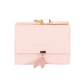 Short pink leather tri-fold wallet for women featuring a gold heart clasp and leaf pendant - Pink