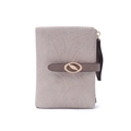 Detailed view of the leaf-textured fabric and golden metal buckle on a compact wallet - Beige Apricot