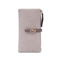 Macro detail of leaf-shaped gold buckle and wrinkled leather texture on long wallet - Beige Apricot