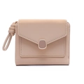 Close-up of pink leather envelope wallet featuring a metal clasp and knotted wrist strap - Apricot