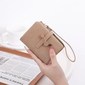 Close-up of khaki matte suede short wallet with wrist strap and zip pocket - Camel