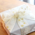 2.5cm Christmas gold foil star and snowy tree sheer ribbon on festive gift box - Width 25MM Length 23M / White