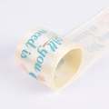 Elegant cream satin ribbon roll with blue text and heart patterns for gift wrapping - Wide Version / Beige