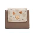 Close-up of cute cartoon bear pattern and golden bear buckle on small bifold wallet - Brown