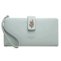 Detail of mint green long wallet featuring lychee texture and leaf silicon buckle - Sky Blue