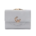 Detail of grey matte leather wallet featuring golden rabbit emblem and kiss-lock closure - Gray