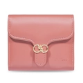 Close-up of pink faux leather wallet featuring golden leaf clasp and fine texture - Coral