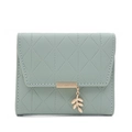 Detail of light green quilted wallet with leaf pendant and golden metal trim - Matcha Green