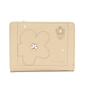Detailed close-up of floral embroidery and metallic flower buckle on beige PU wallet - Yellow