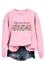 Detail of pink sweatshirt with floral Grandma text print and ribbed crew neck design - Pink Sweatshirt (Black Text Pattern)