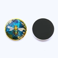 Macro view showing both sides of a 25mm bee patterned glass magnet with a magnetic back - Golden Bee With Blue Geometric Floral Style (JY008891-12)
