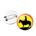Sunset cowboy silhouette badge with orange gradient and metal safety pin back - Silver