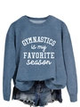 Detailed view of gymnastics slogan print on blue long-sleeve sweatshirt fabric texture - Blue Sweatshirt (White Font)