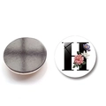 Macro view of circular magnet featuring letter H with floral motifs and magnetic backing - Letter H Style (XSWX6582-H)
