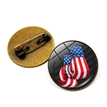 Macro view of boxing glove brooch with US flag pattern and bronze metal safety pin - Bronze-Boxing Gloves