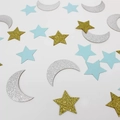 Macro shot of gold and silver glitter moon and star confetti decorations on white background - Mixed Gold Silver Blue Style