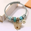 Pandora style gold and silver charm bracelet with pearl butterfly pendant and enamel beads - Silver & Blue